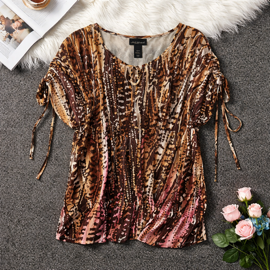 Lane Bryant blouse features a lightweight, semi-sheer chiffon fabric. Size 18/20